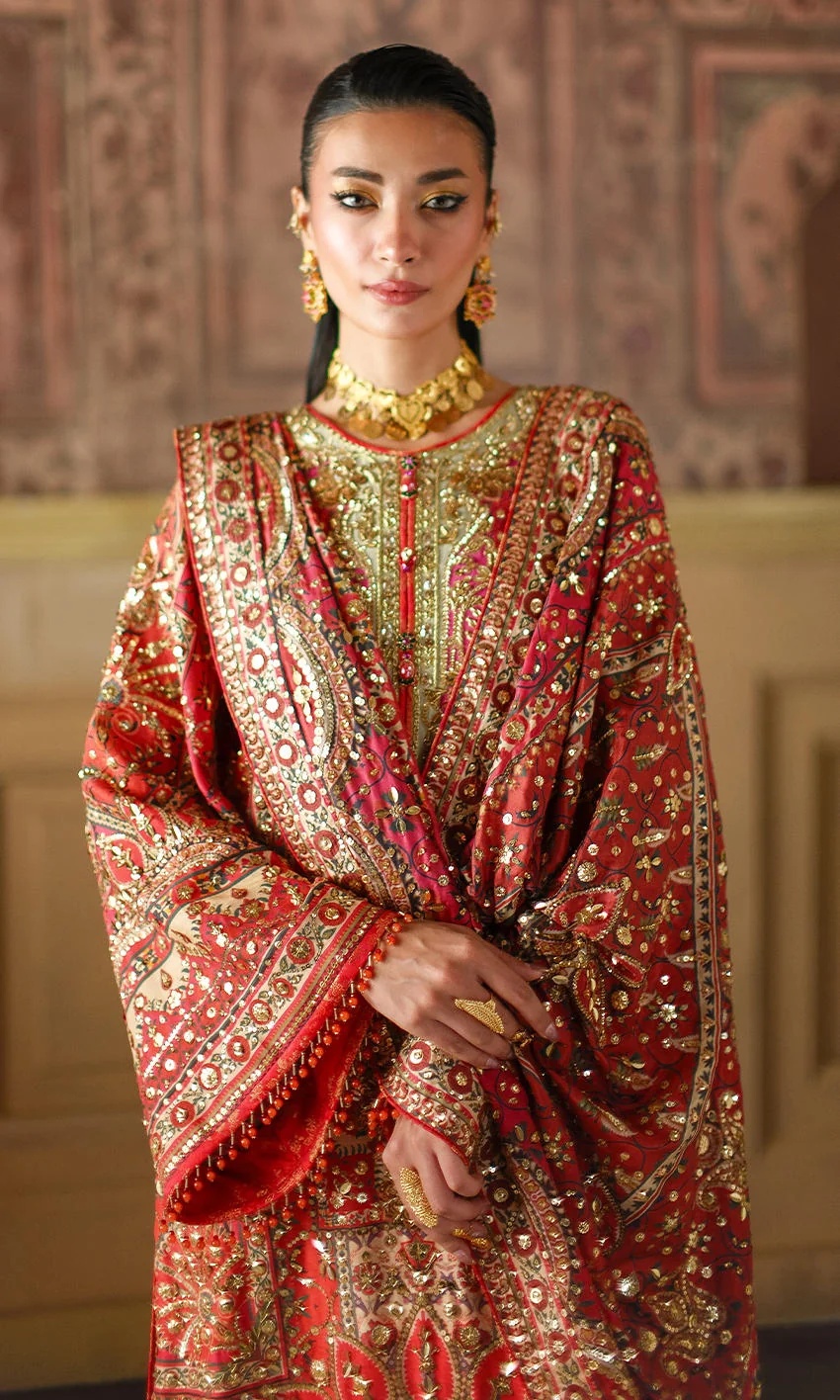 CRIMSON TALE I NOMI ANSARI clothing in gold, red tones.